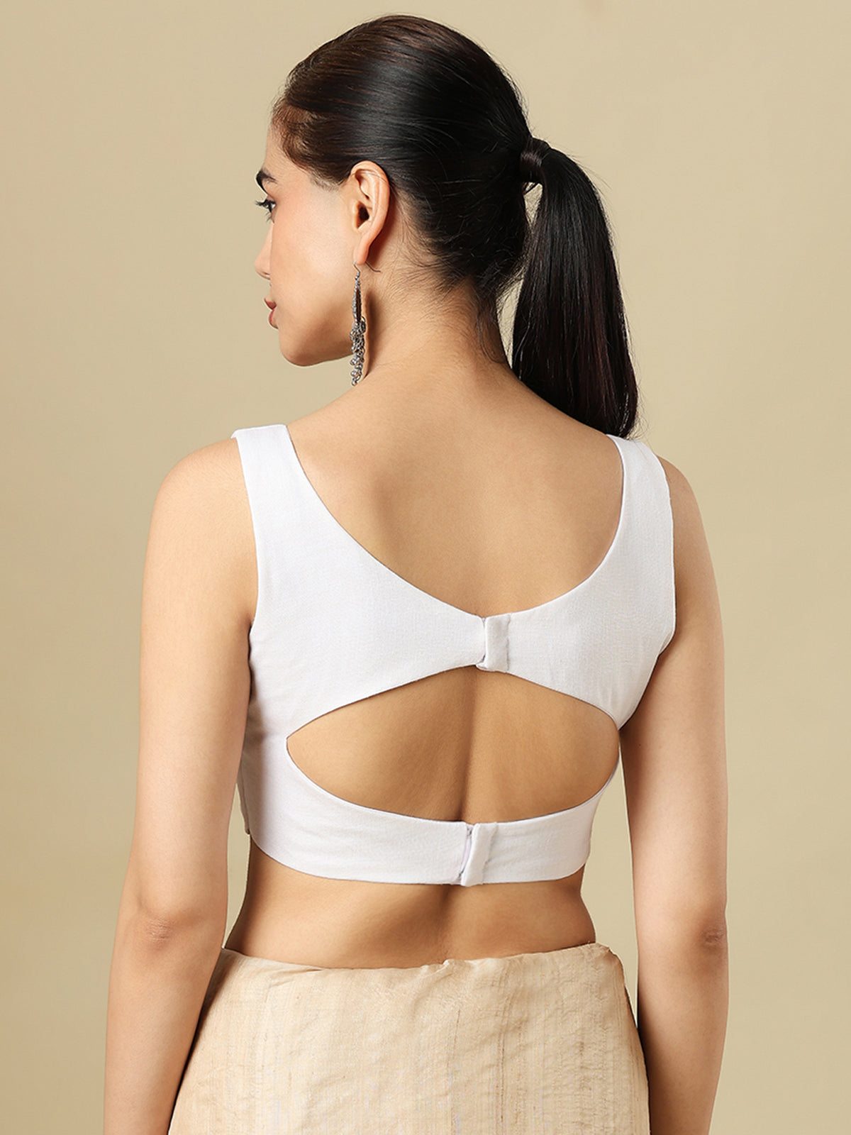 White linen solid blouse with V neck and sleeveless silhouette