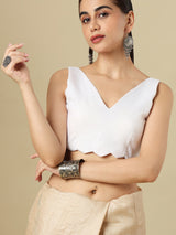 White linen solid blouse with V neck and sleeveless silhouette