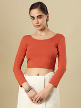 Rust orange cotton solid blouse with round neckline and quarter sleeves