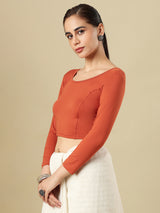 Rust orange cotton solid blouse with round neckline and quarter sleeves