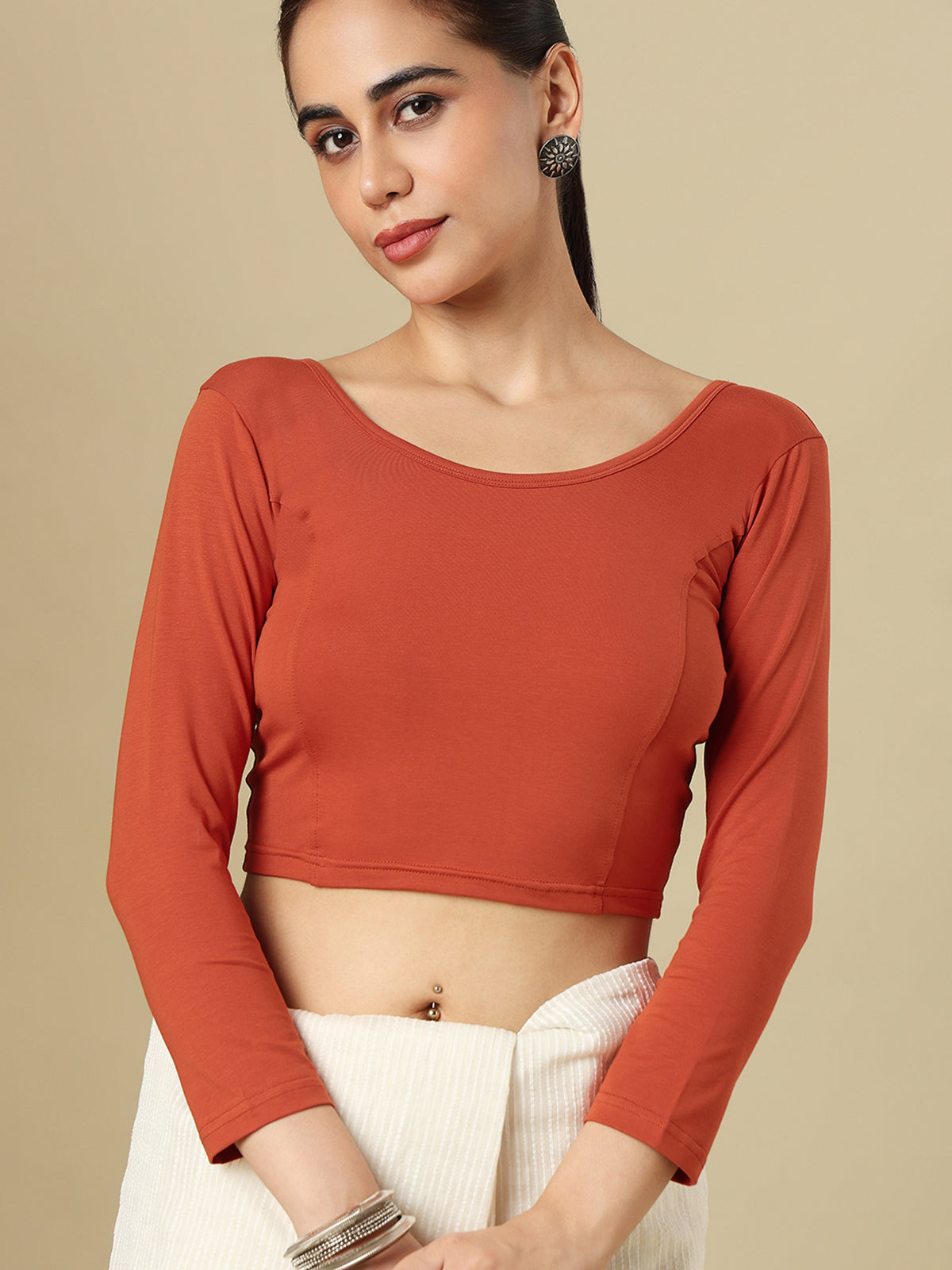 Rust orange cotton solid blouse with round neckline and quarter sleeves