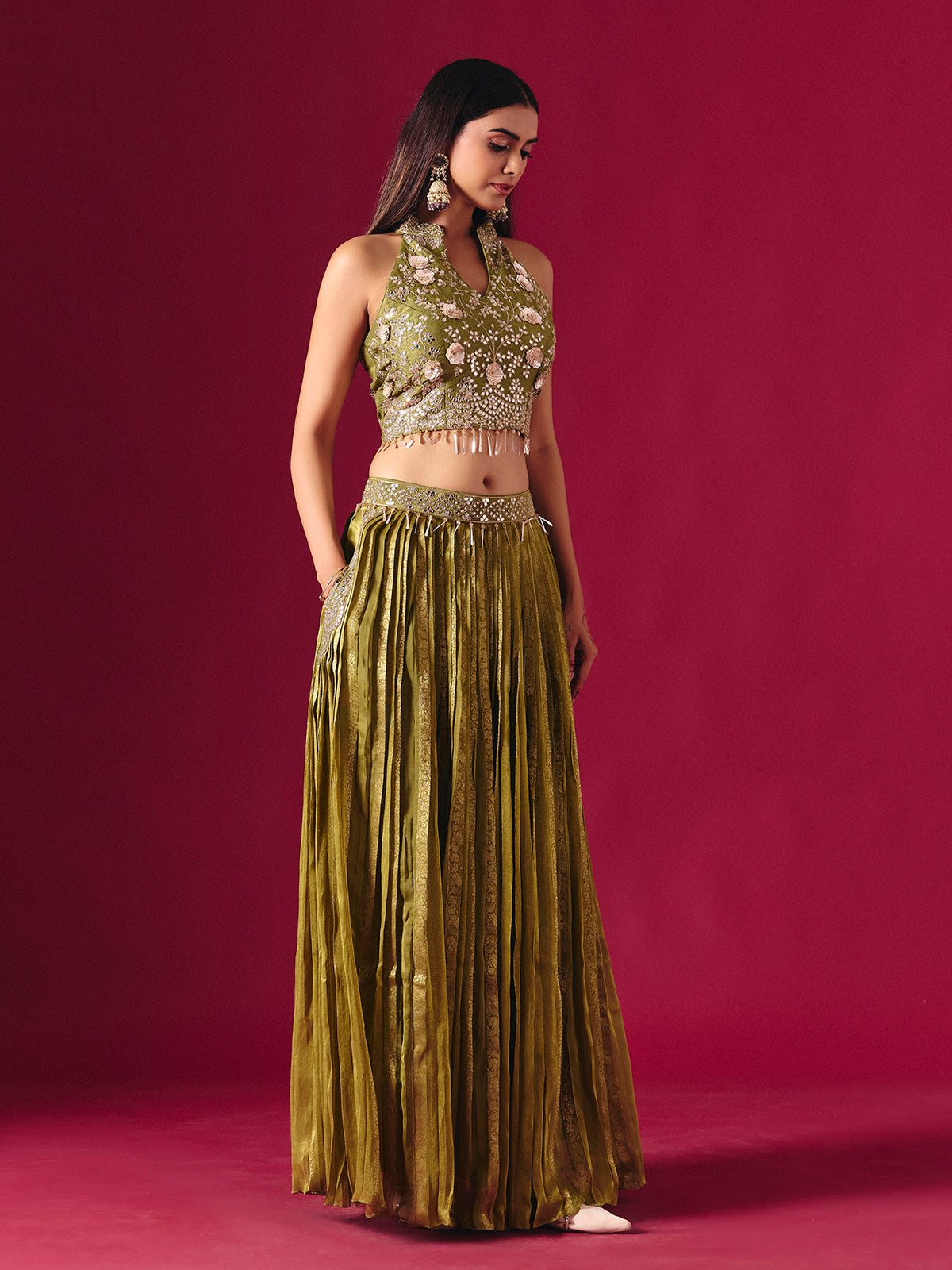 Olive green tissue silk lehenga choli with mirror and zari embellishments