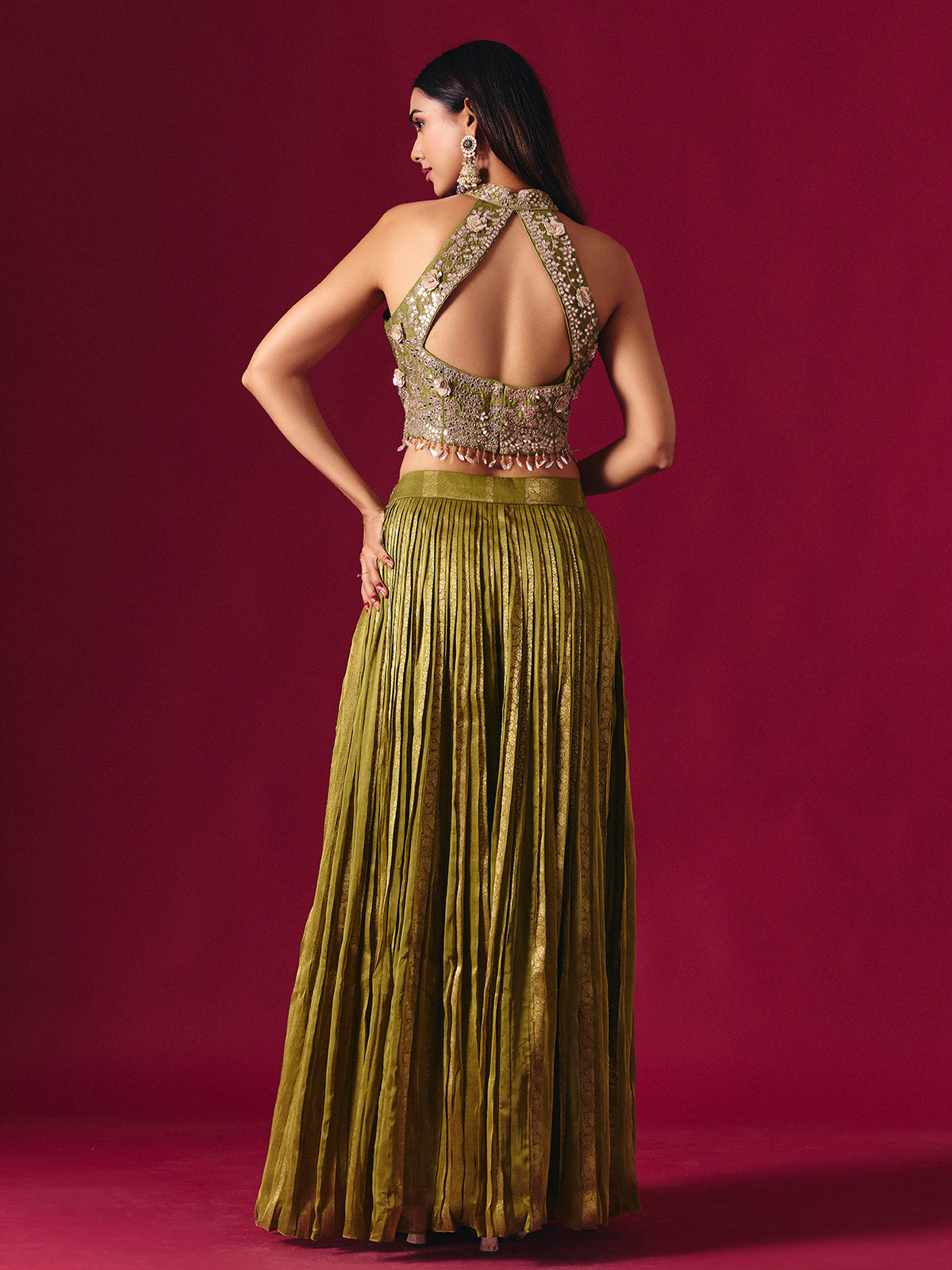Olive green tissue silk lehenga choli with mirror and zari embellishments