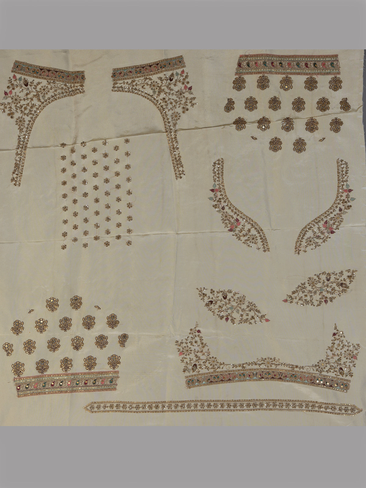 Cream silk unstitched lehenga choli with elegant butta embellishments