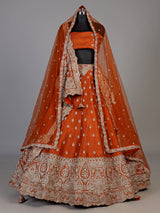 Rust orange raw silk unstitched lehenga choli with ornate butti detailing