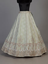 Mint green silk unstitched lehenga choli with intricate zari elegance