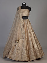 Beige silk unstitched lehenga choli with exquisite zardosi artistry