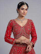 Red silk lehenga choli with exquisite resham and cutdana detailing