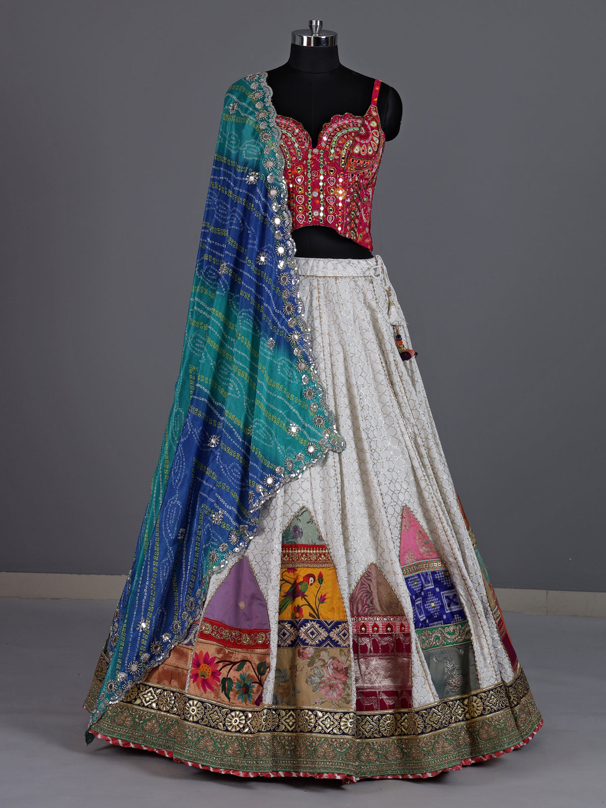 White silk blend lehenga choli with intricate traditional embellishments