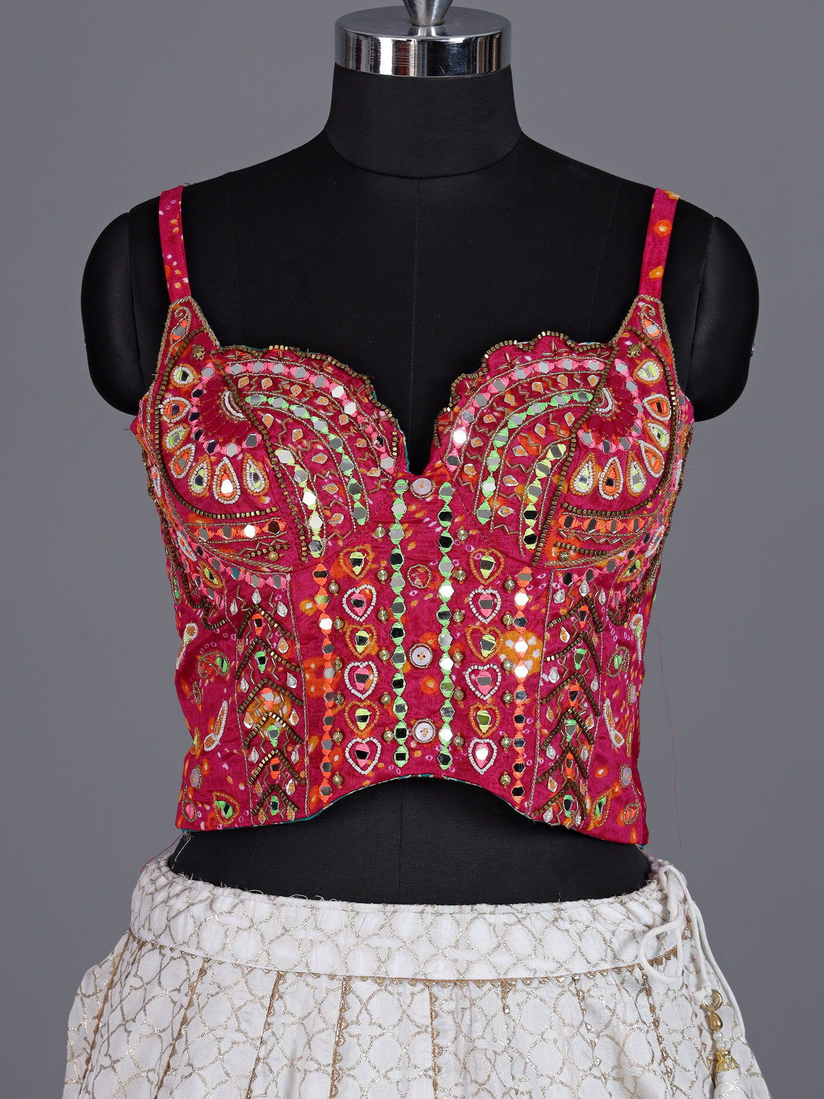 White silk blend lehenga choli with intricate traditional embellishments