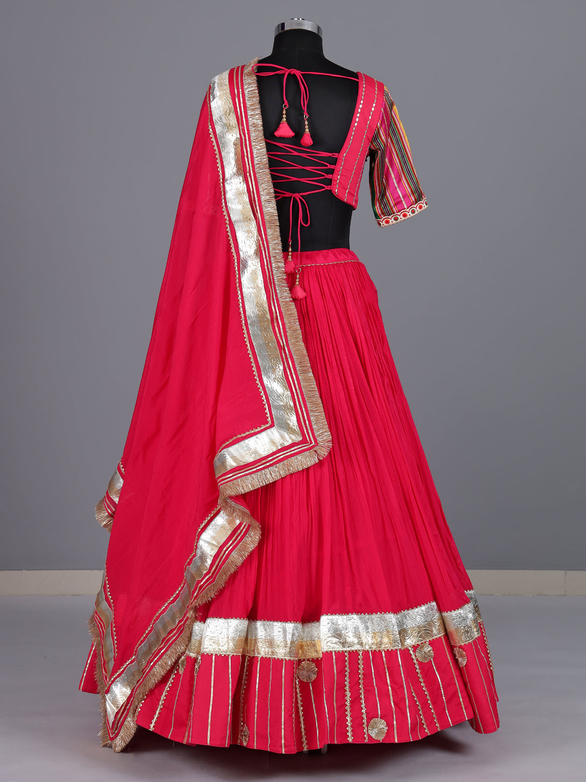 Rani pink chiffon silk lehenga choli with exquisite festive embellishments