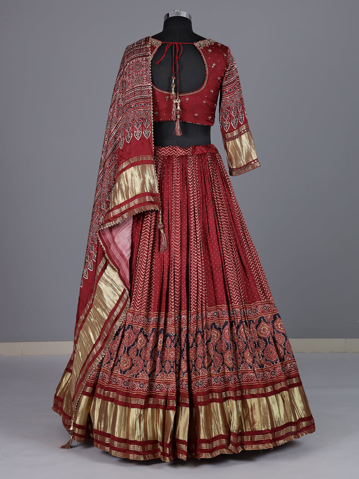 Maroon gajji silk lehenga choli with regal festive embellishments