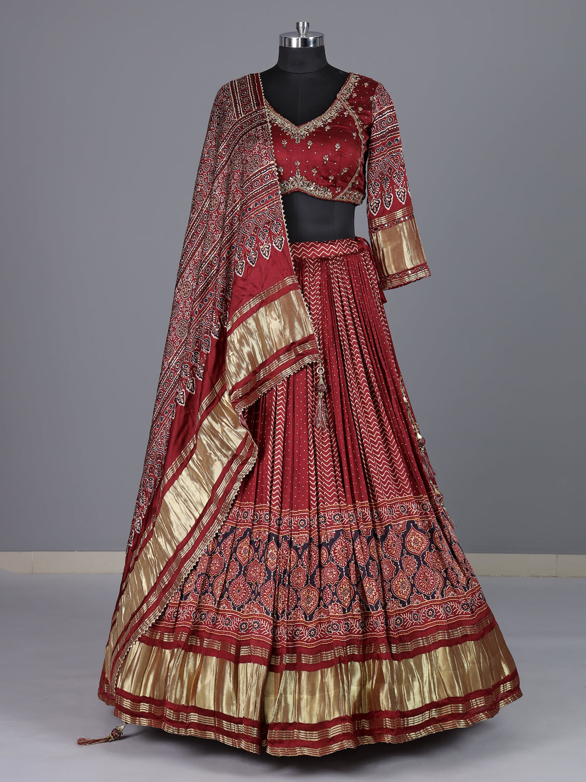 Maroon gajji silk lehenga choli with regal festive embellishments