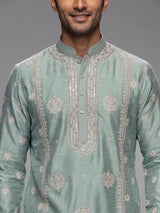 Mint blue raw silk mens kurta suit with graceful butti detailing