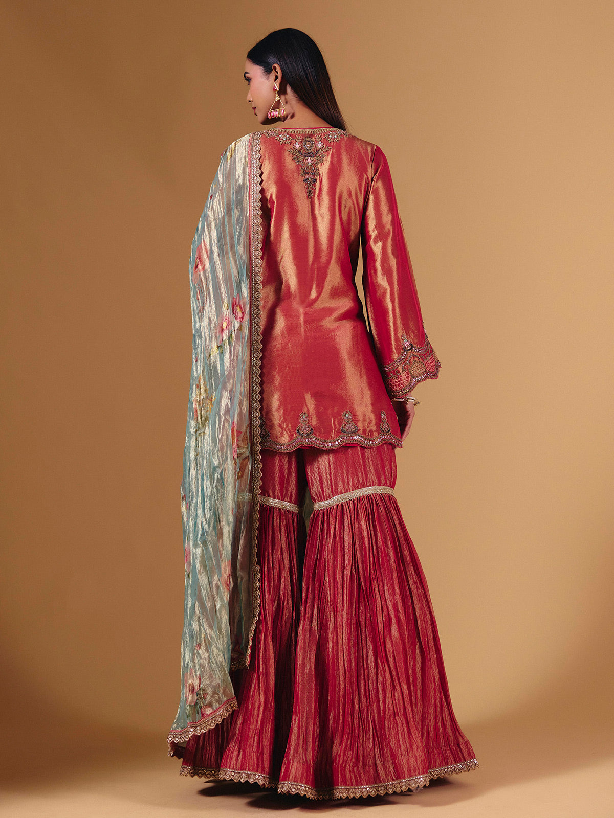 Pastel peach silk sharara suit with cutdana embellishments