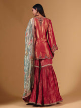 Pastel peach silk sharara suit with cutdana embellishments
