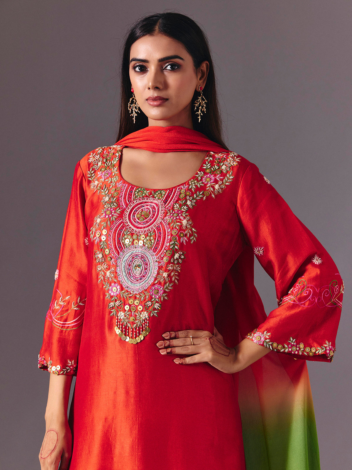 Radiant orange silk pant suit with zardosi embellishments
