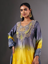 Yellow silk shaded salwar suit with purple dupatta and embellishments