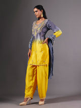 Yellow silk shaded salwar suit with purple dupatta and embellishments