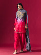 Pretty pink silk shaded salwar suit with purple dupatta detailing