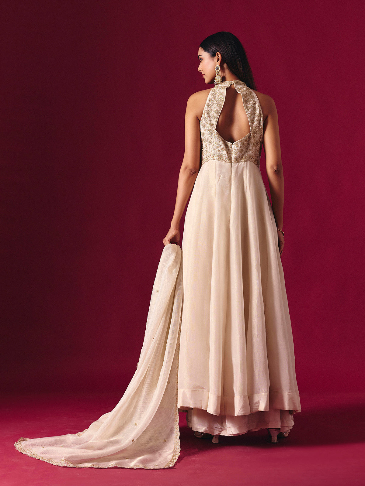 Off white silk embroidered halter neck festive palazzo suit with dupatta