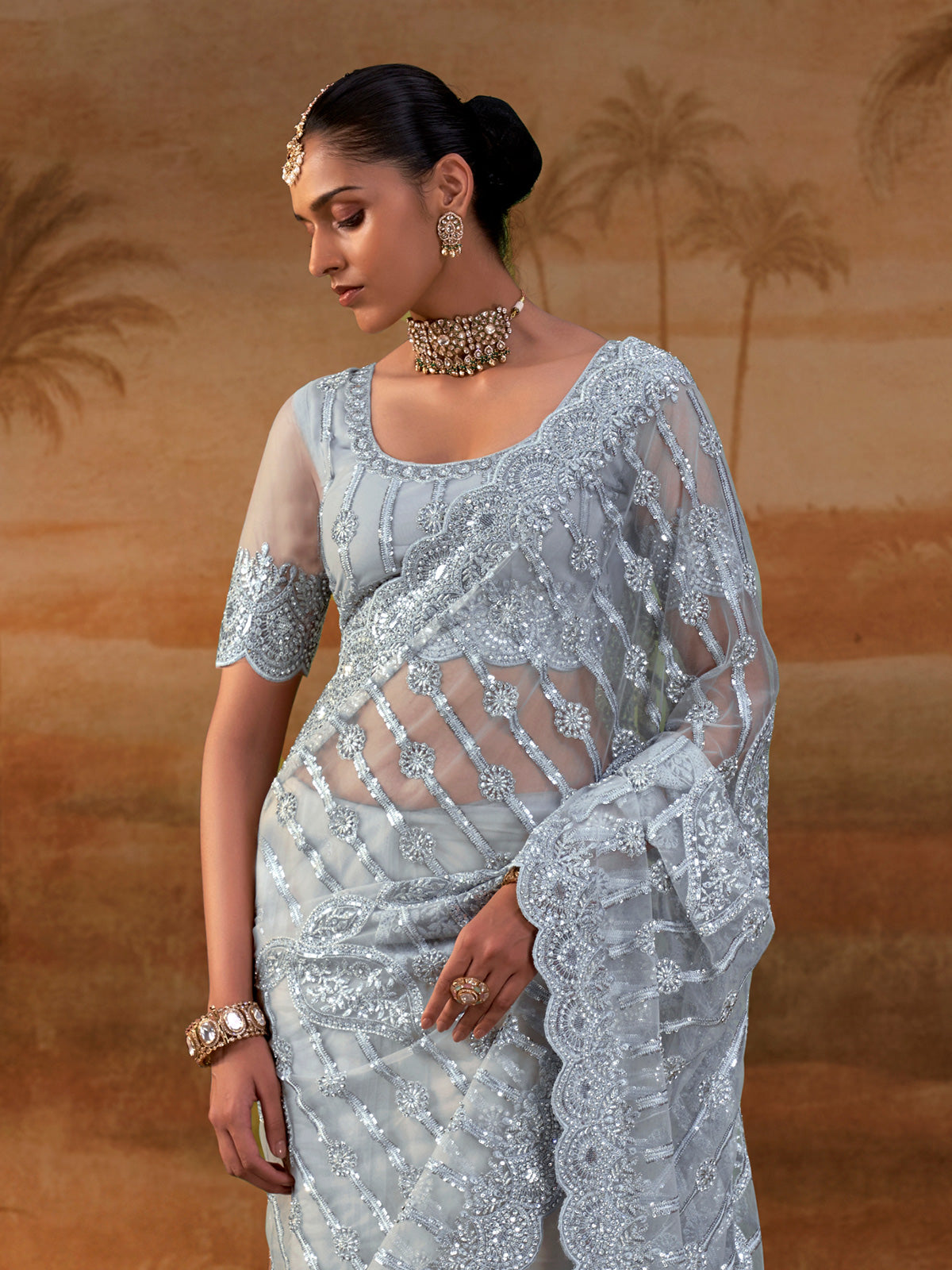 Sky blue net womens embellished saree with unstitched blouse