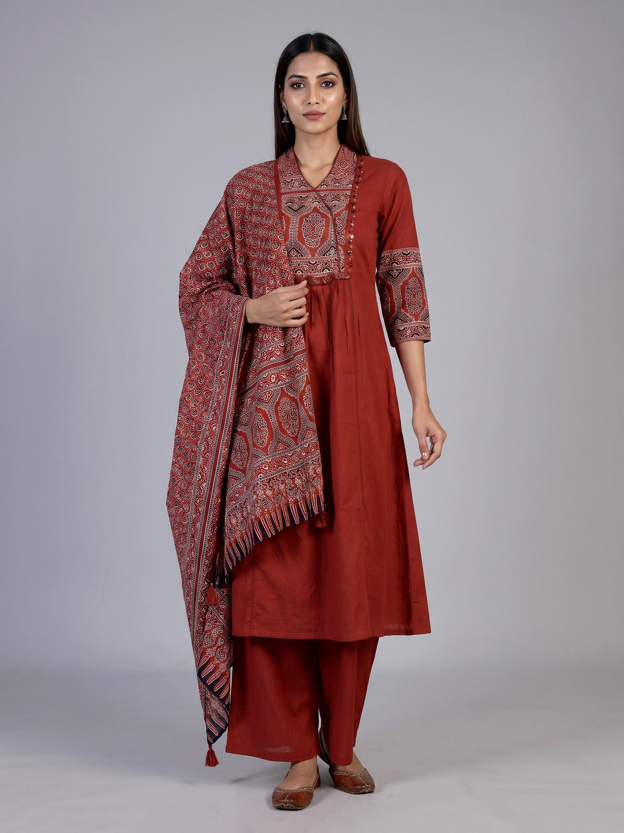 Rust red cotton blend anarkali kurti set with festive embellishments