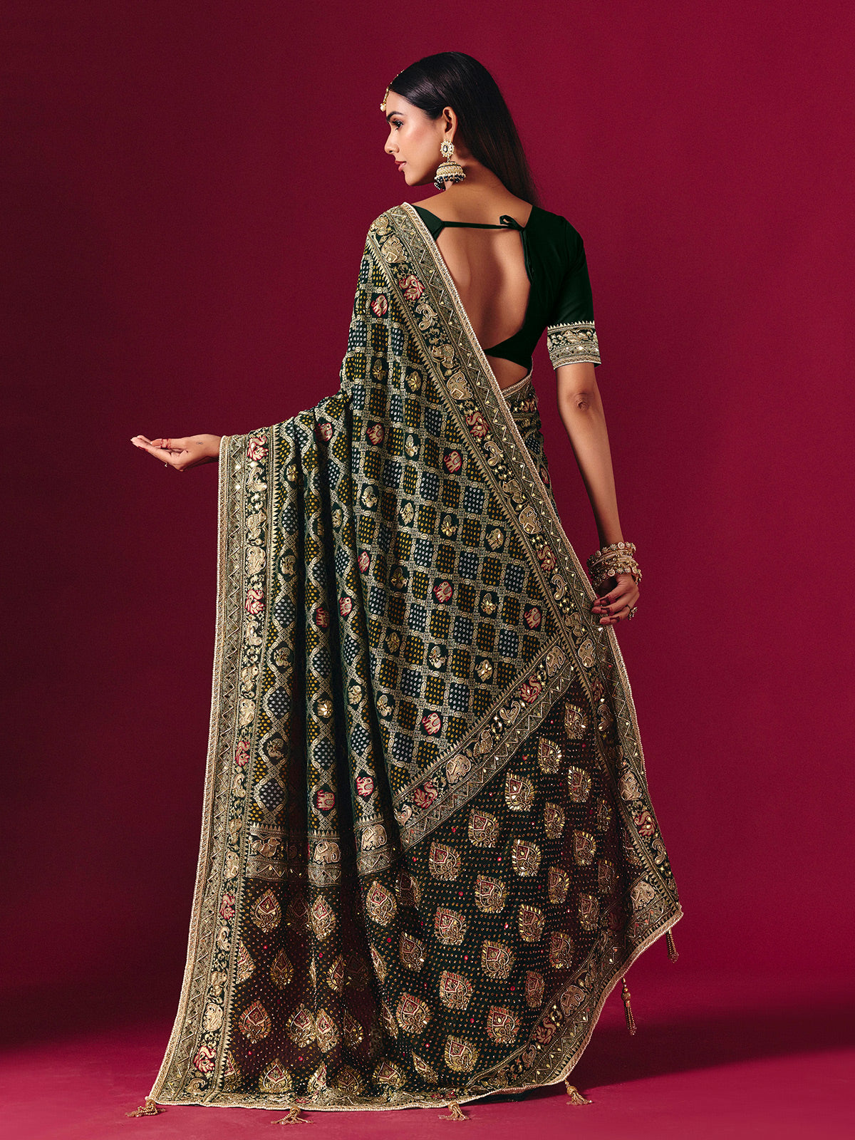 Green georgette saree with traditional handcrafted detailing