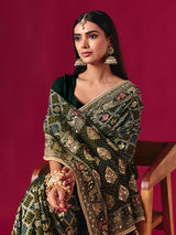 Green georgette saree with traditional handcrafted detailing