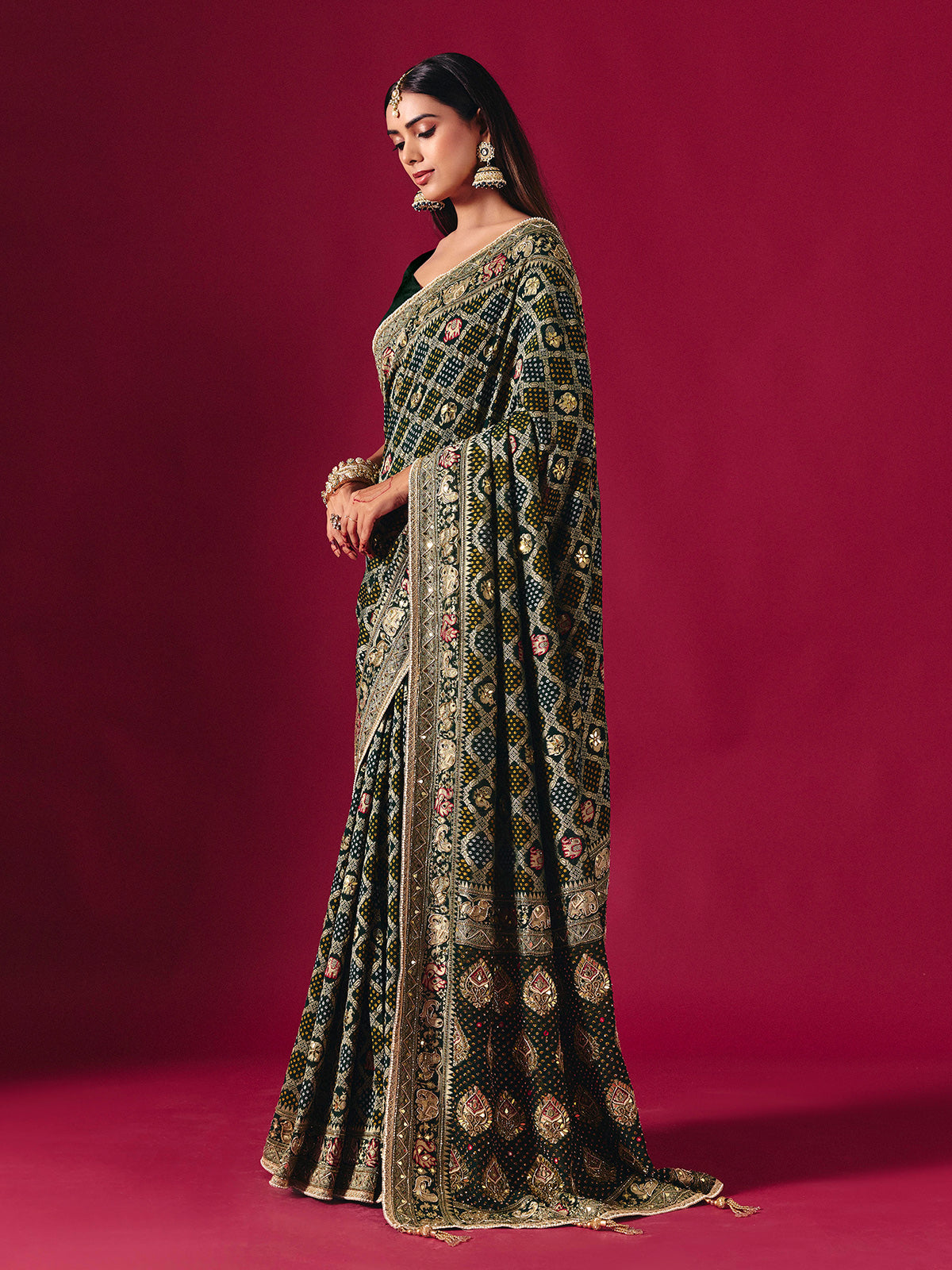 Green georgette saree with traditional handcrafted detailing