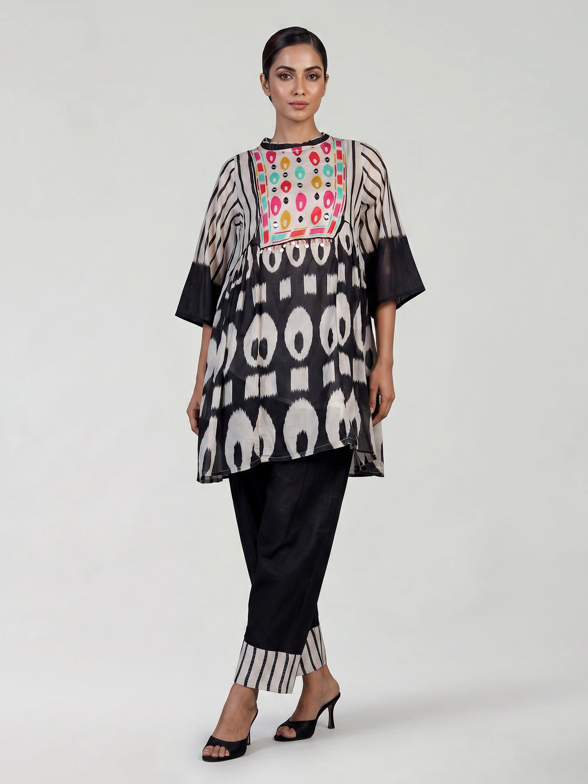 Black silk salwar suit with bandhgala neckline and ornamental detailing