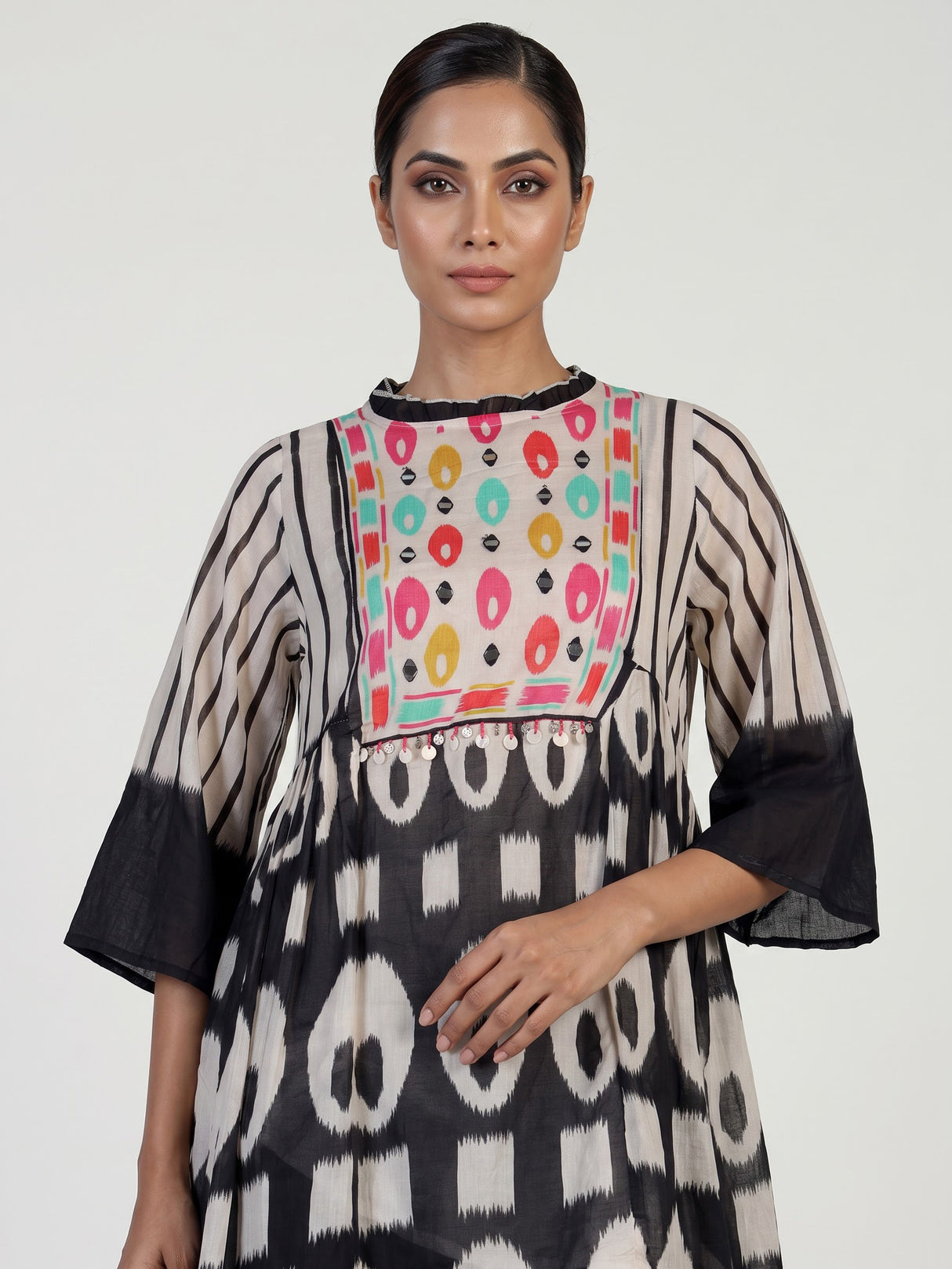 Black silk salwar suit with bandhgala neckline and ornamental detailing