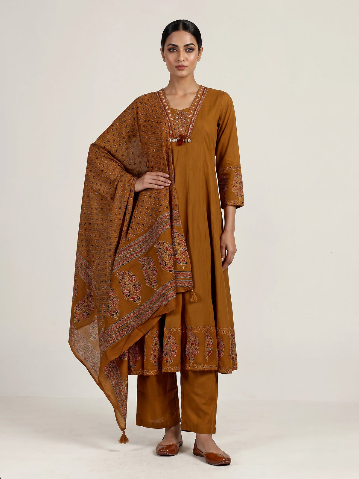 Mustard yellow cotton silk anarkali kurti set with tassel accents