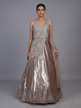 Sophisticated beige shimmer tissue silk lehenga choli with tassel accents