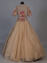 Beige organza tissue lehenga choli with embroidered jacket detailing