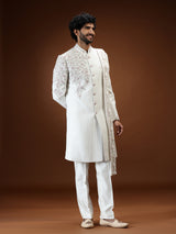 Cream silk mens sherwani with floral shoulder detailing
