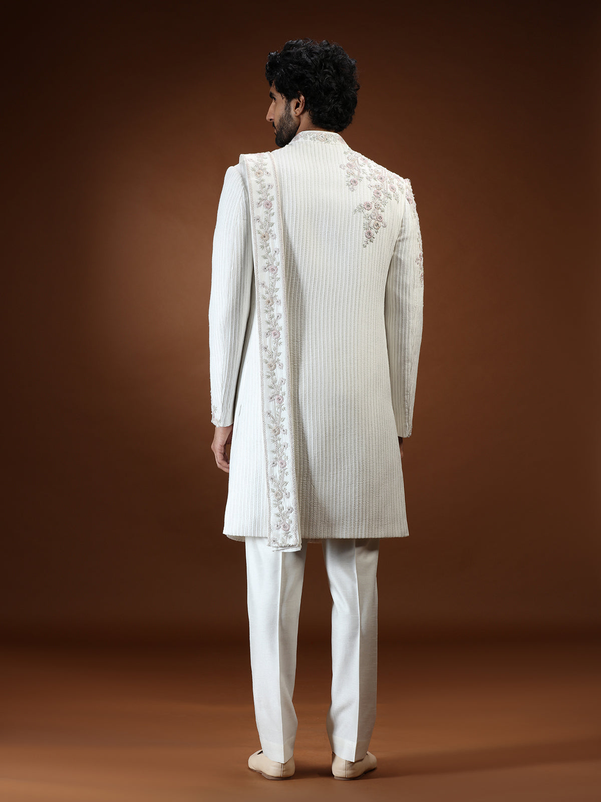 Cream silk mens sherwani with floral shoulder detailing