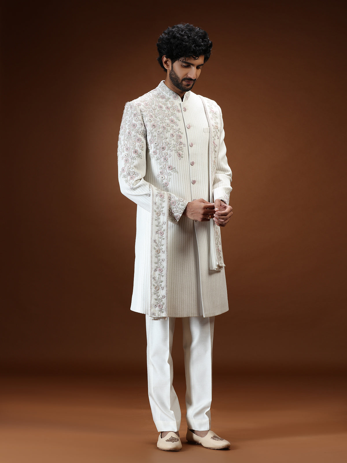Cream silk mens sherwani with floral shoulder detailing