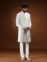 Cream silk mens sherwani with floral shoulder detailing