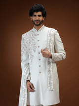 Cream silk mens sherwani with floral shoulder detailing