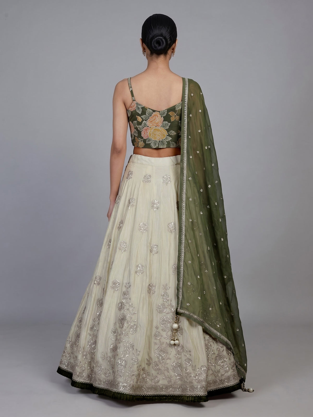 Regal mehendi green silk lehenga choli with intricate embellishments