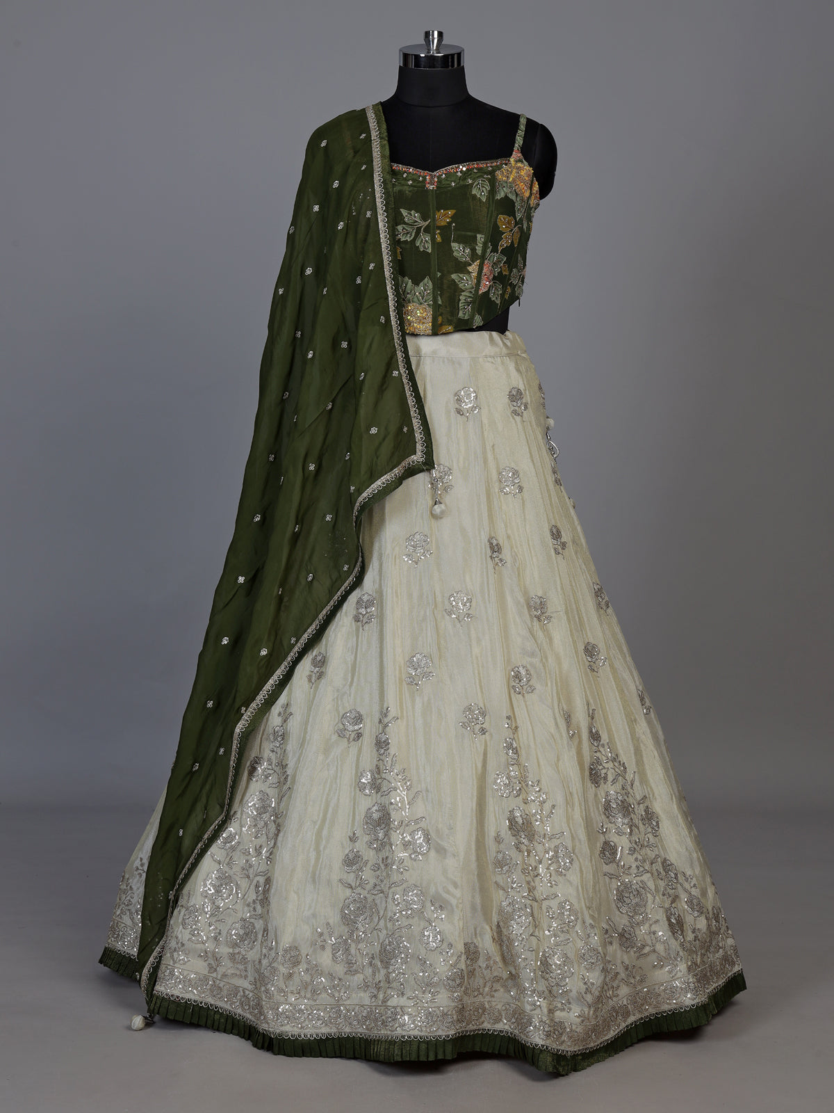 Regal mehendi green silk lehenga choli with intricate embellishments