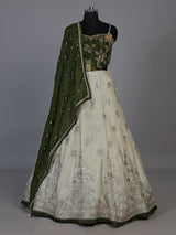 Regal mehendi green silk lehenga choli with intricate embellishments
