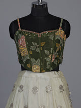 Regal mehendi green silk lehenga choli with intricate embellishments