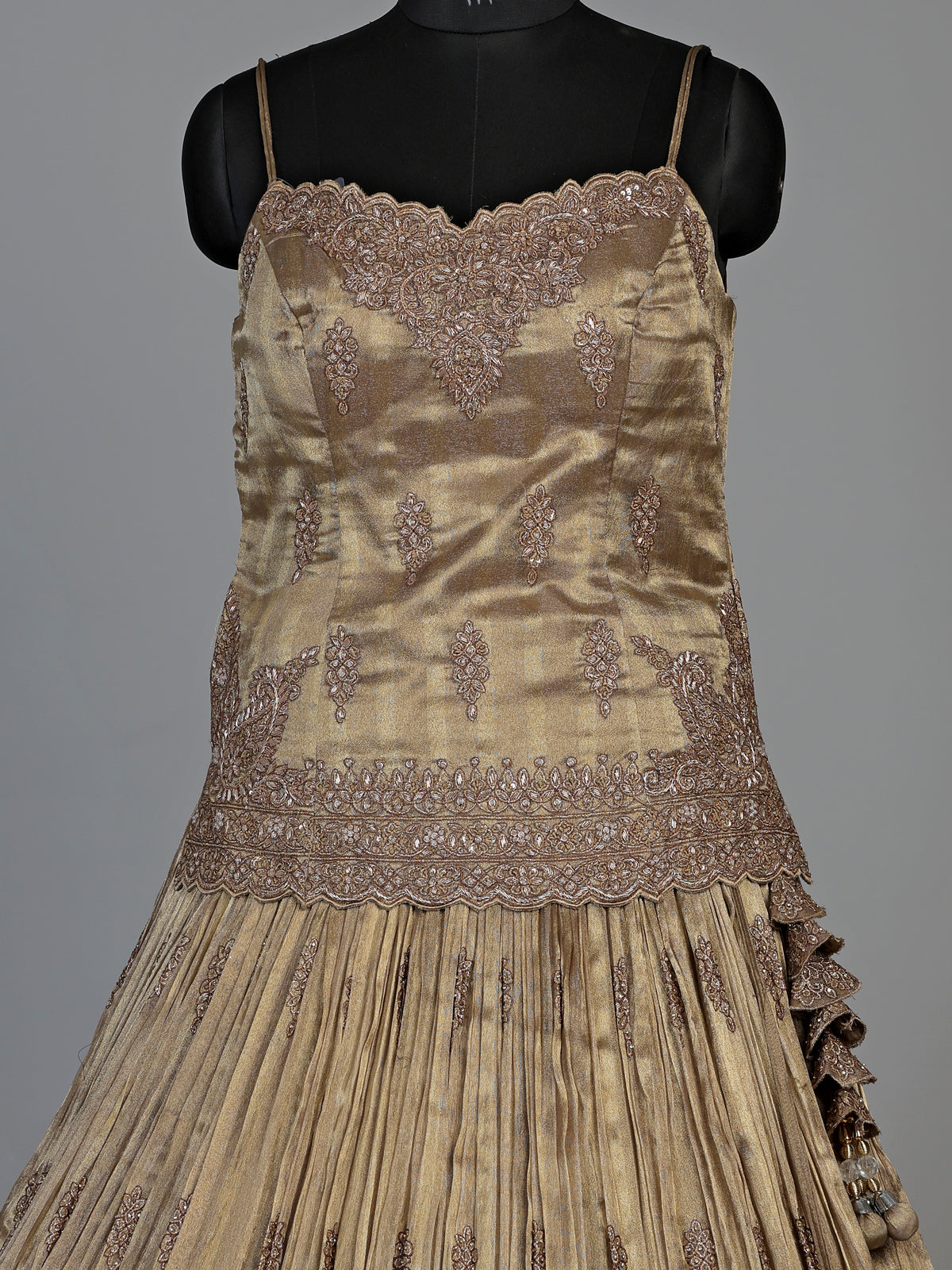 Golden zardosi embellished women’s shimmer silk lehenga choli