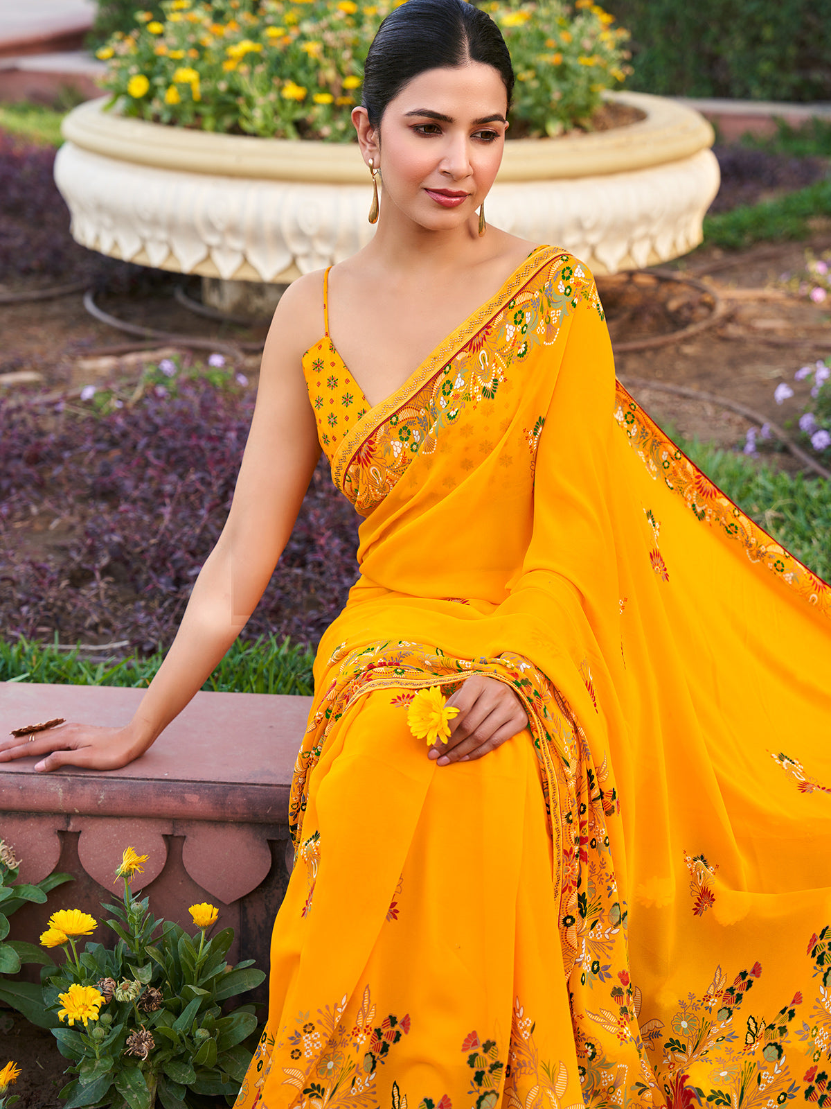 Yellow georgette saree with printed stone detailing