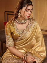 Golden yellow tissue silk women saree with rich detailing