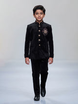 Black velvet boys jodhpuri suit with regal crest detailing