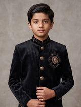 Black velvet boys jodhpuri suit with regal crest detailing