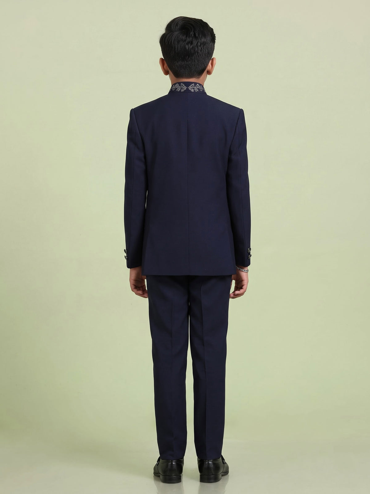 Navy boys jodhpuri suit with embellished crest motif for celebrations